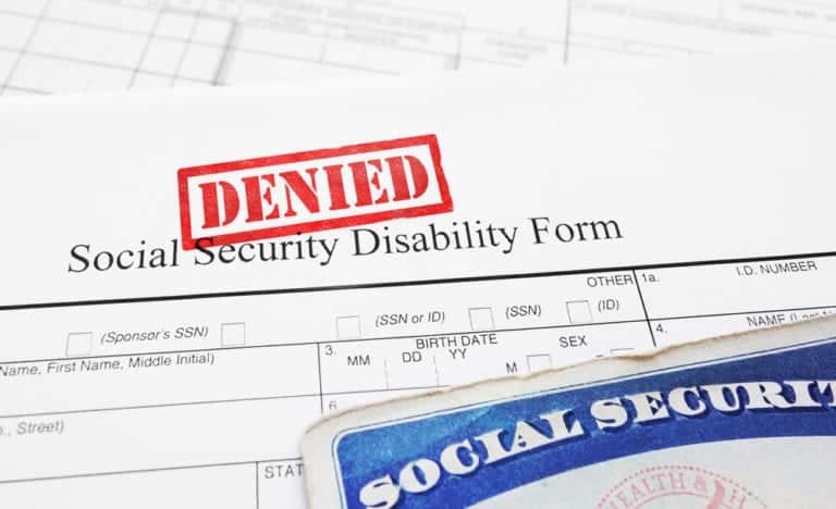 Security Security Disability Form with Denied stamp, Social Security card