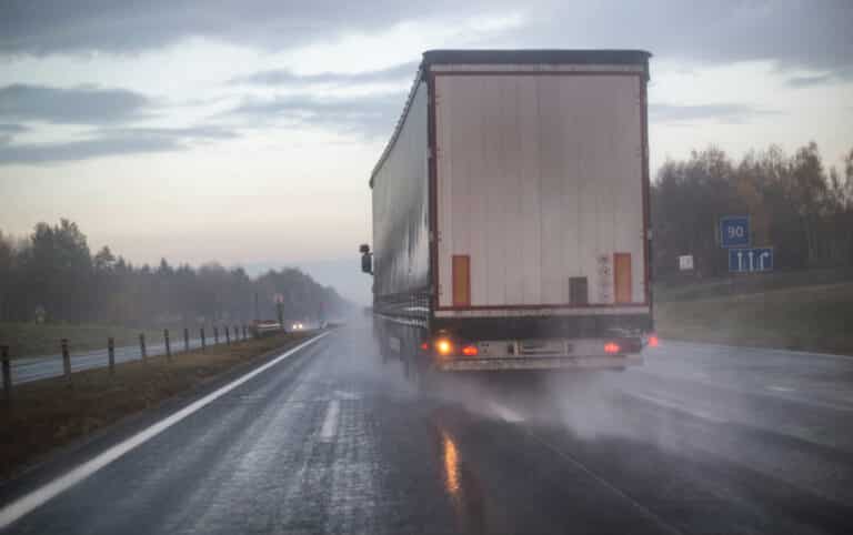 Semi truck on a rainy wet highway