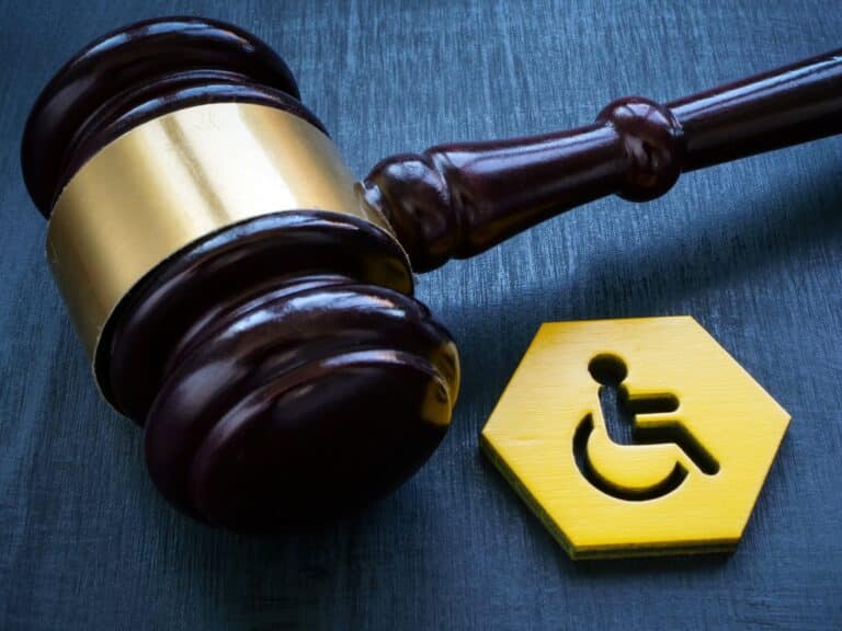 Gavel beside token with handicapped icon