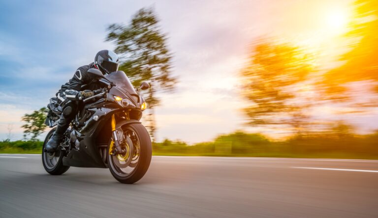 Motorcycle rider at sunset