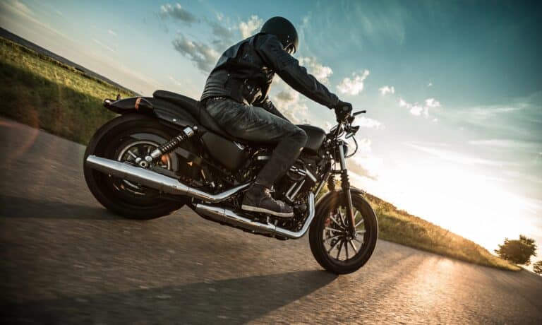 man on motorcycle at sunset